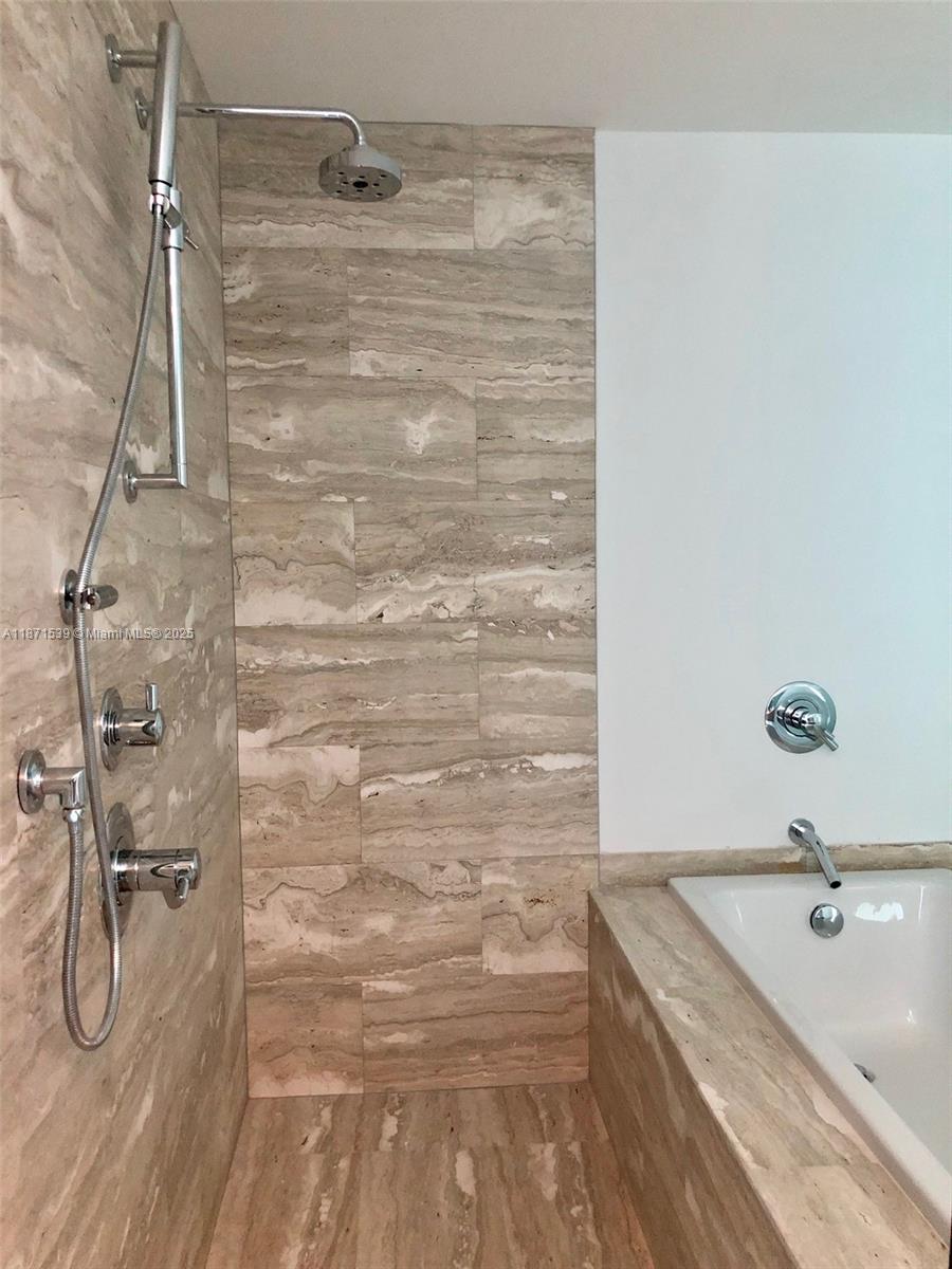 2900 Northeast 7th Avenue, Unit 2404 Miami, FL 33137 - Photo 14 of 42 a bathroom with a granite countertop sink a toilet and shower