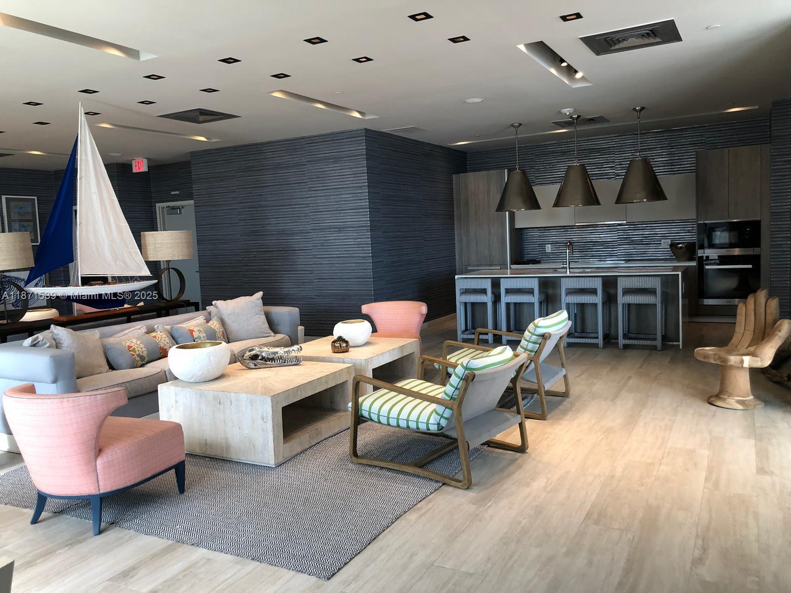 2900 Northeast 7th Avenue, Unit 2404 Miami, FL 33137 - Photo 25 of 42 a living room with furniture and kitchen