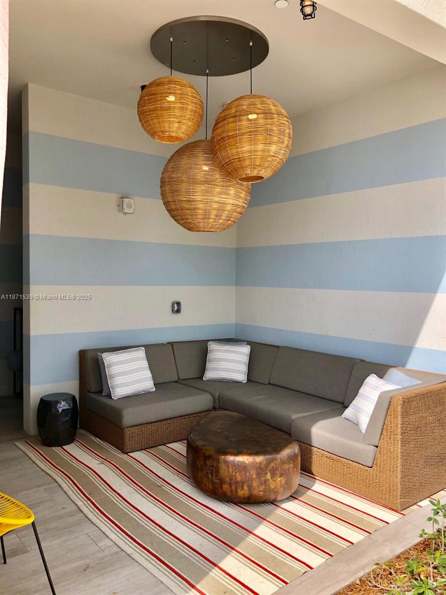 2900 Northeast 7th Avenue, Unit 2404 Miami, FL 33137 - Photo 32 of 42 a living room with furniture and chandelier
