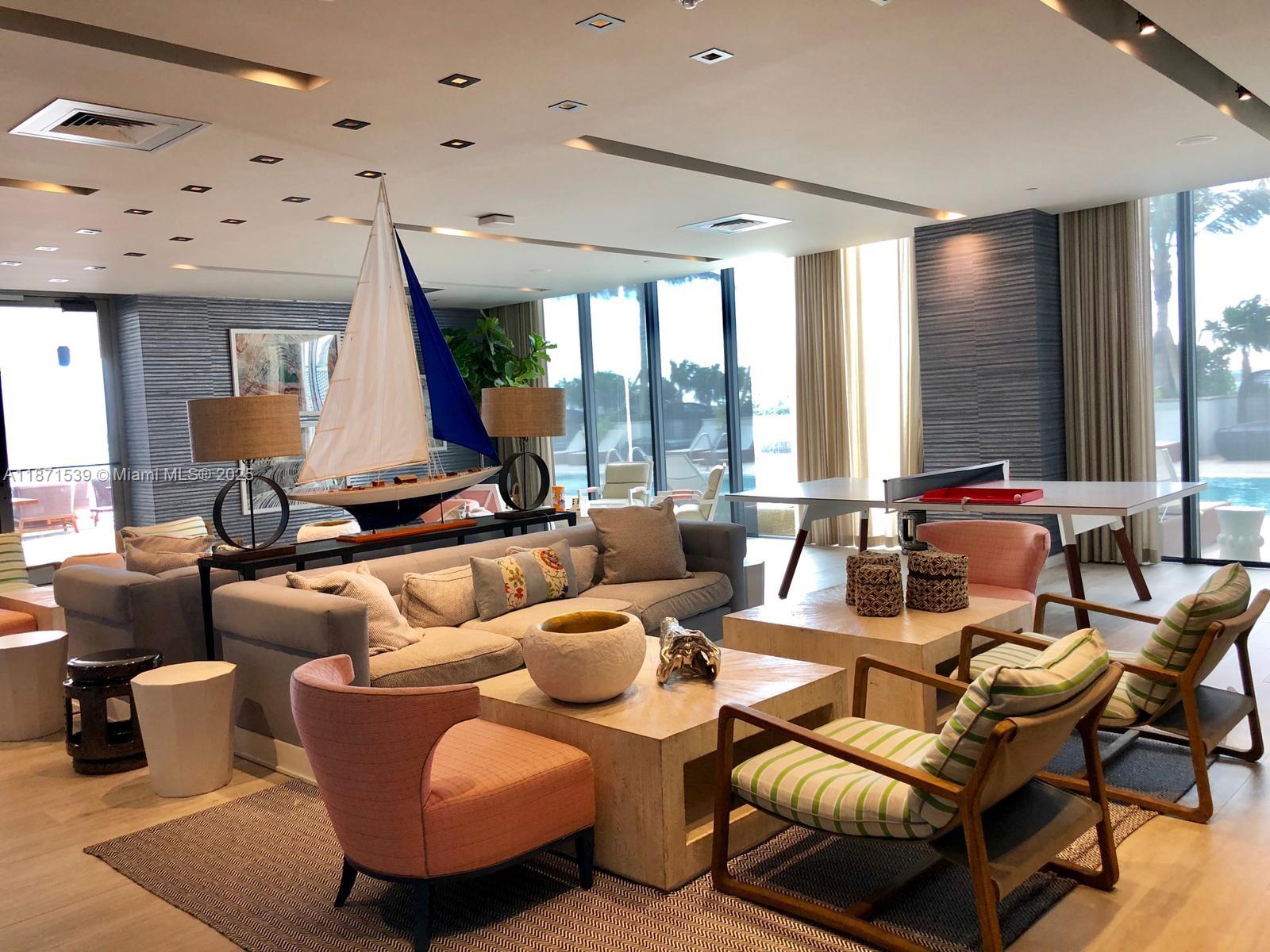 2900 Northeast 7th Avenue, Unit 2404 Miami, FL 33137 - Photo 10 of 42 a living room with furniture and large windows