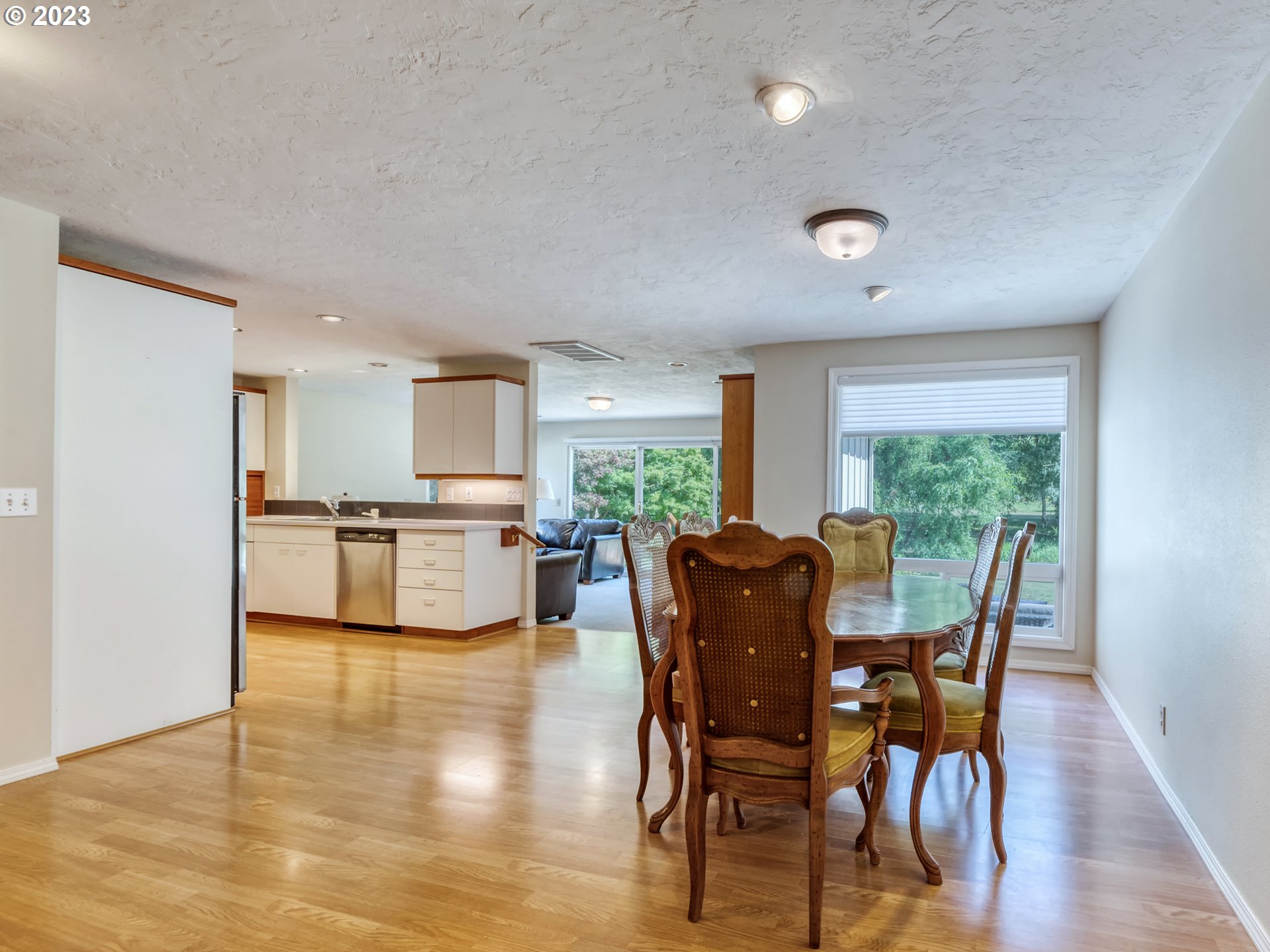 40176 York Lane Springfield, OR 97478 - Photo 11 of 48 a view of a dining room with furniture window and wooden floor
