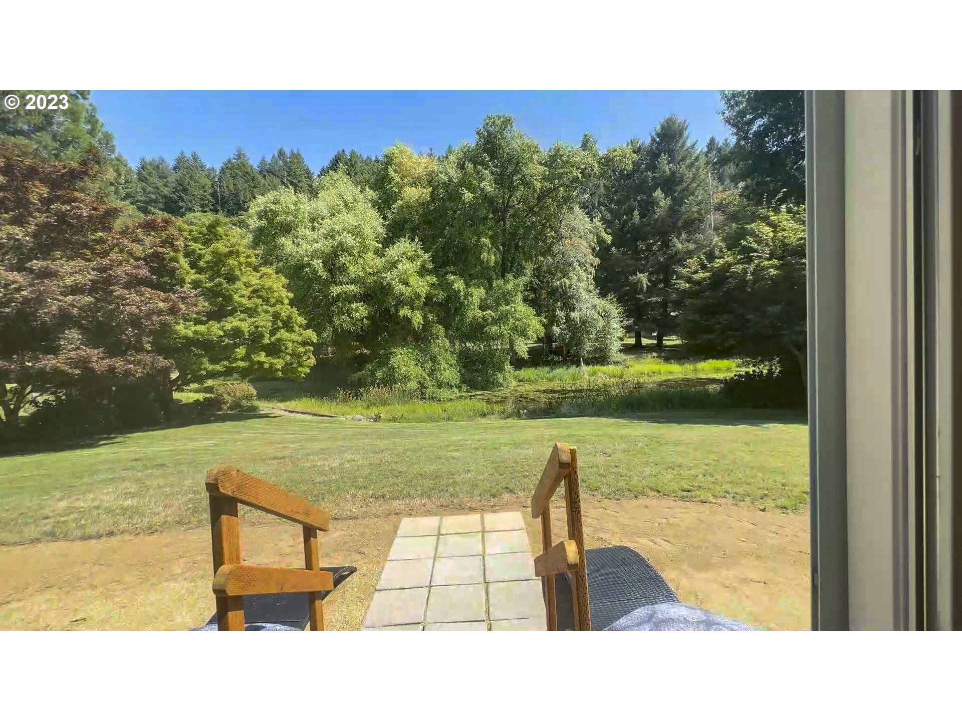 40176 York Lane Springfield, OR 97478 - Photo 28 of 48 a view of a swimming pool and a yard