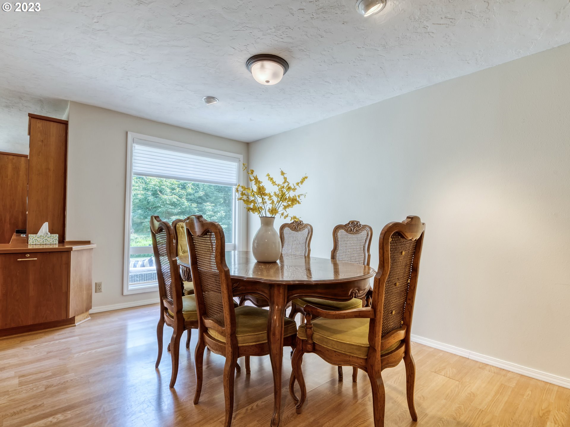 40176 York Lane Springfield, OR 97478 - Photo 9 of 48 a view of a dining room with furniture and wooden floor
