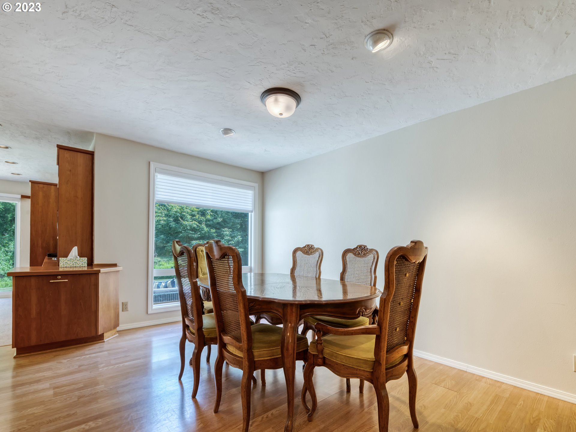 40176 York Lane Springfield, OR 97478 - Photo 10 of 48 a view of a dining room with furniture and wooden floor