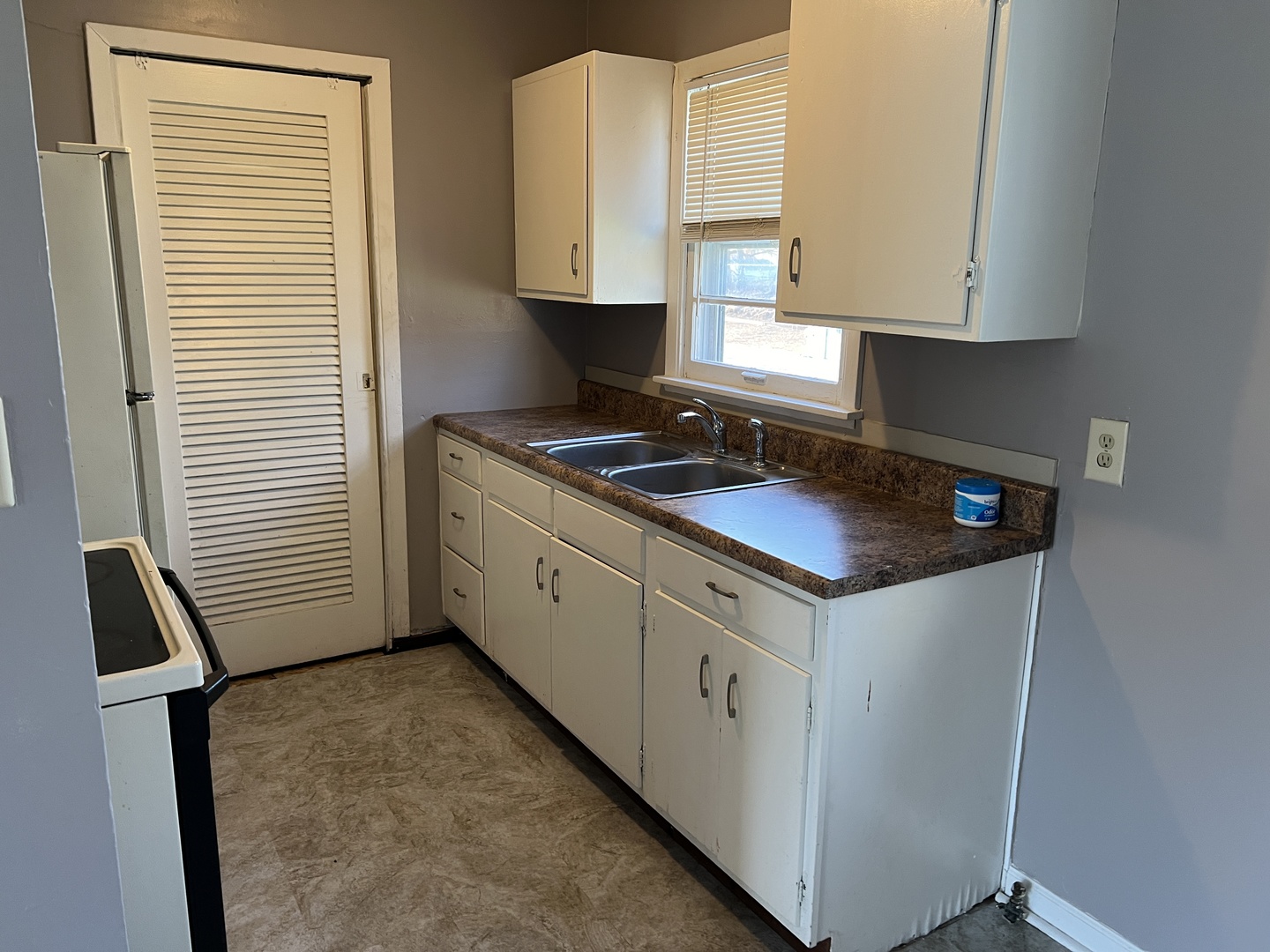 60 Webster Court Decatur, IL 62521 - Photo 6 of 19 a kitchen with granite countertop a sink a stove and cabinets