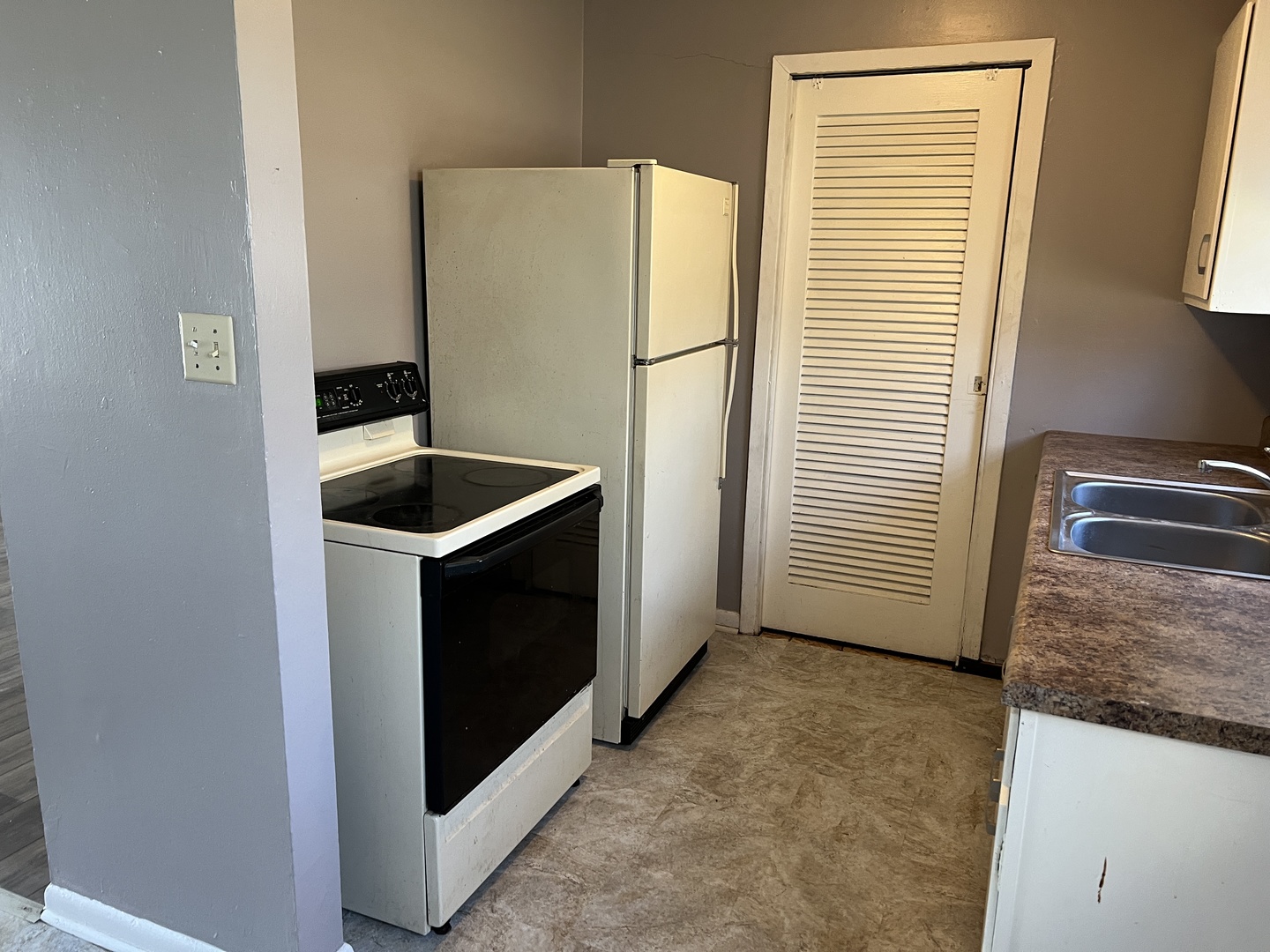 60 Webster Court Decatur, IL 62521 - Photo 7 of 19 a kitchen with a refrigerator sink and microwave