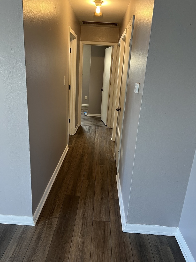 60 Webster Court Decatur, IL 62521 - Photo 8 of 19 a view of a hallway with wooden floor