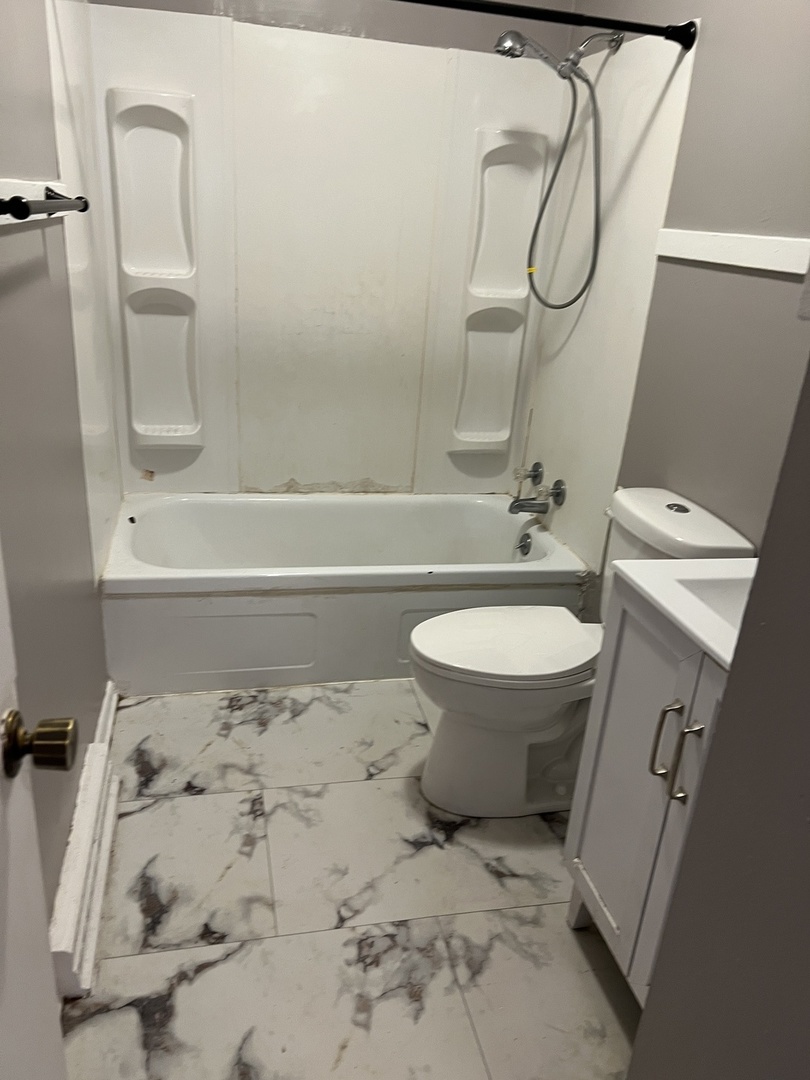 60 Webster Court Decatur, IL 62521 - Photo 9 of 19 a bathroom with a sink toilet and shower