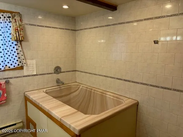 a bathroom with a sink and a shower