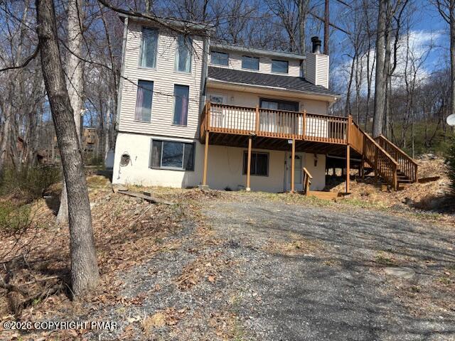 141 Mansfield Court Bushkill, PA 18324 - Photo 2 of 28 front view of a building with a yard
