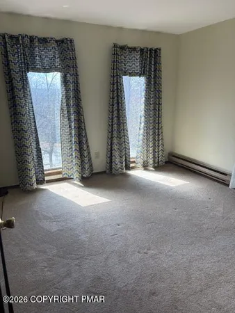 an empty room with windows