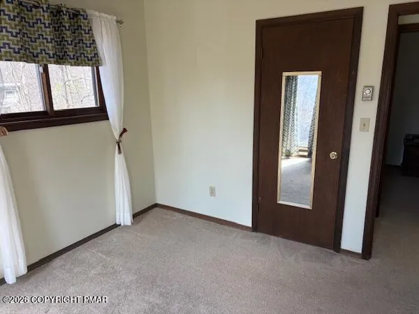 a view of balcony with furniture