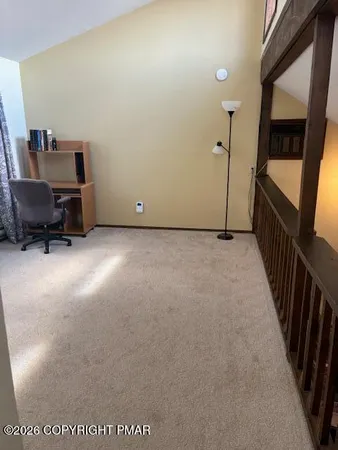 a view of a hallway with workspace