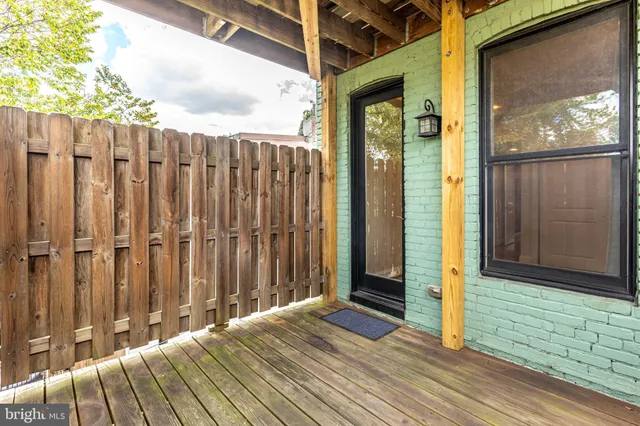 a view of a balcony with wooden floor