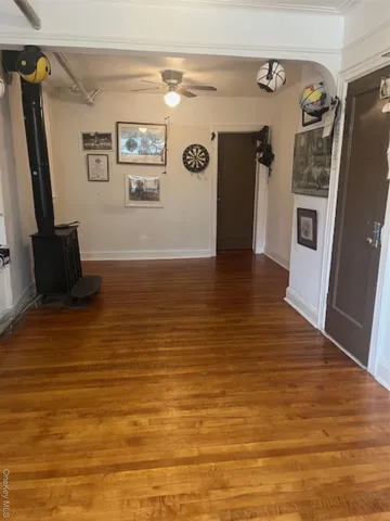 a view of a refrigerator in kitchen and wooden floor