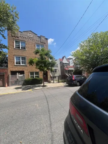 a view of street with parked cars