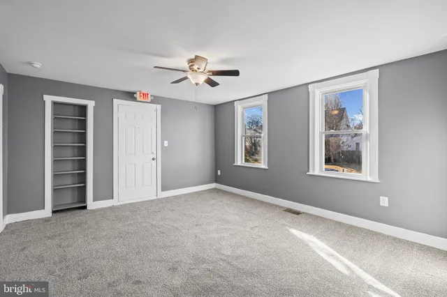 a kitchen with stainless steel appliances granite countertop a refrigerator sink and microwave