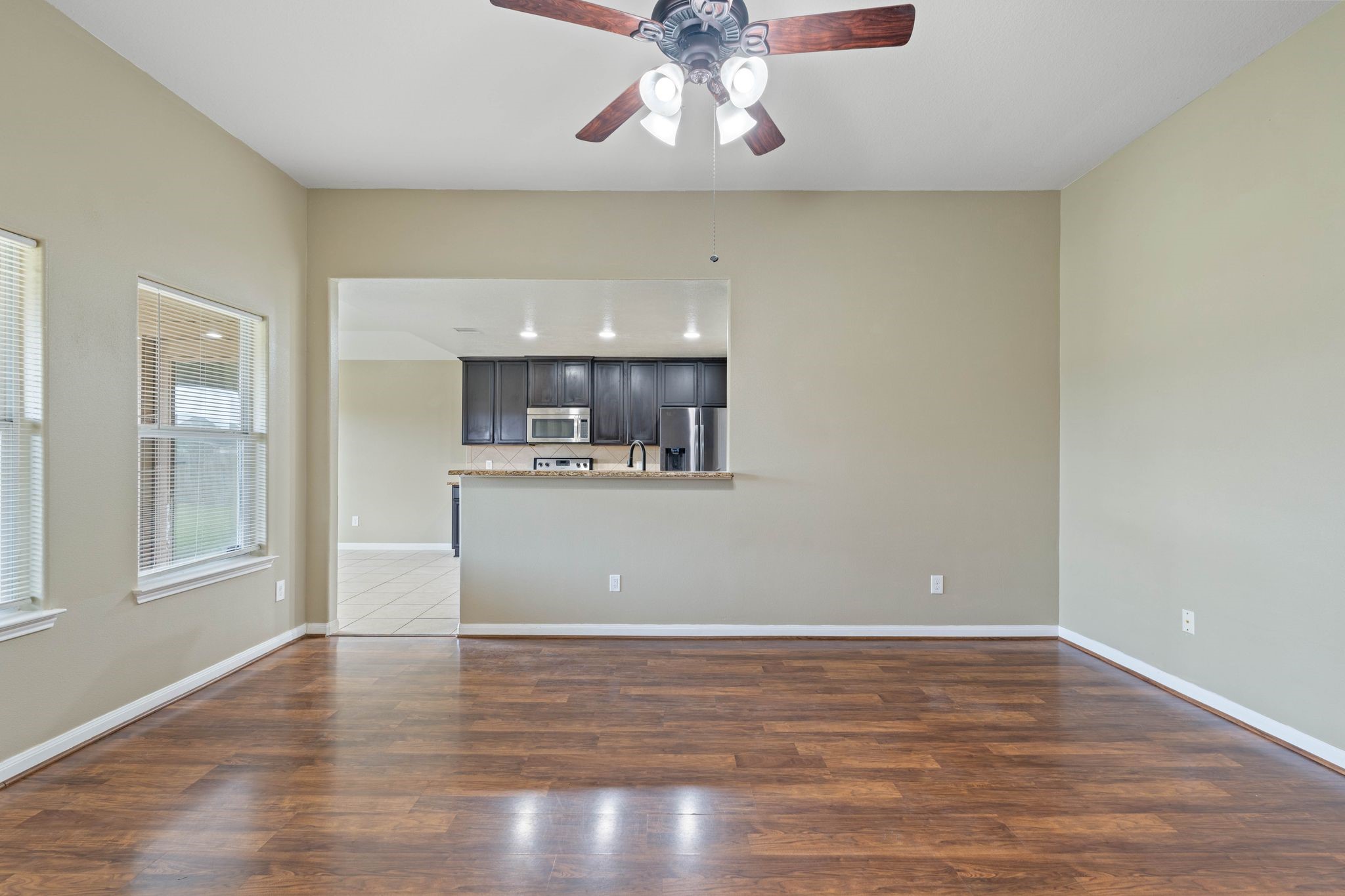 18875 Maverick Ranch Road East Magnolia, TX 77355 - Photo 14 of 45 a view of kitchen and hall with wooden floor