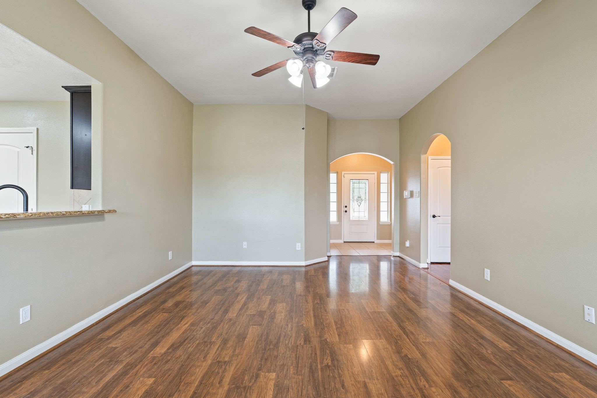 18875 Maverick Ranch Road East Magnolia, TX 77355 - Photo 19 of 45 a view of an empty room with window and wooden floor