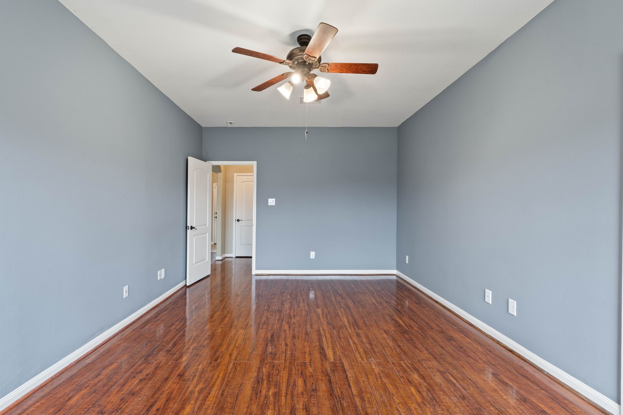 18875 Maverick Ranch Road East Magnolia, TX 77355 - Photo 22 of 45 a view of an empty room with wooden floor