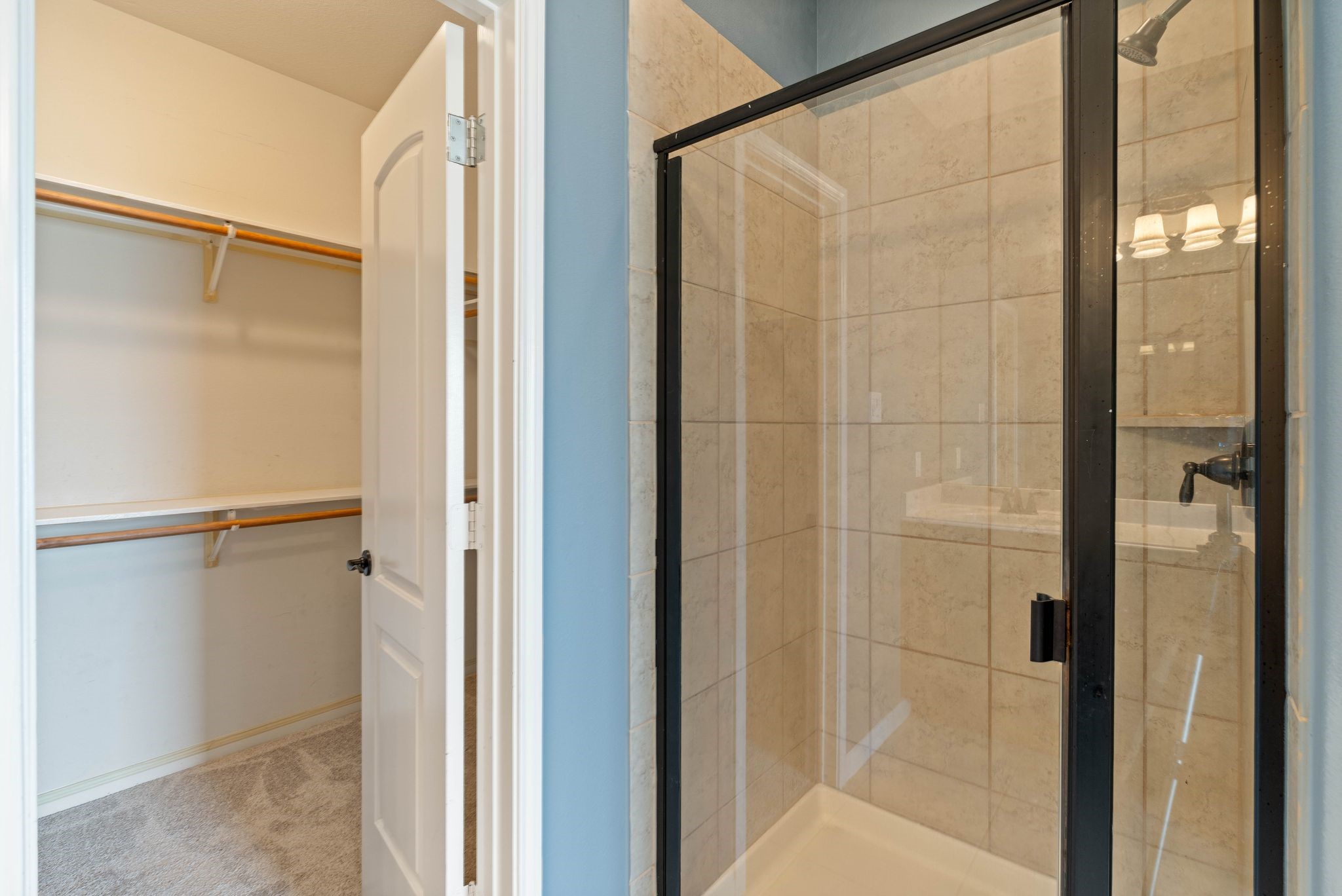 18875 Maverick Ranch Road East Magnolia, TX 77355 - Photo 27 of 45 a bathroom with a glass shower door
