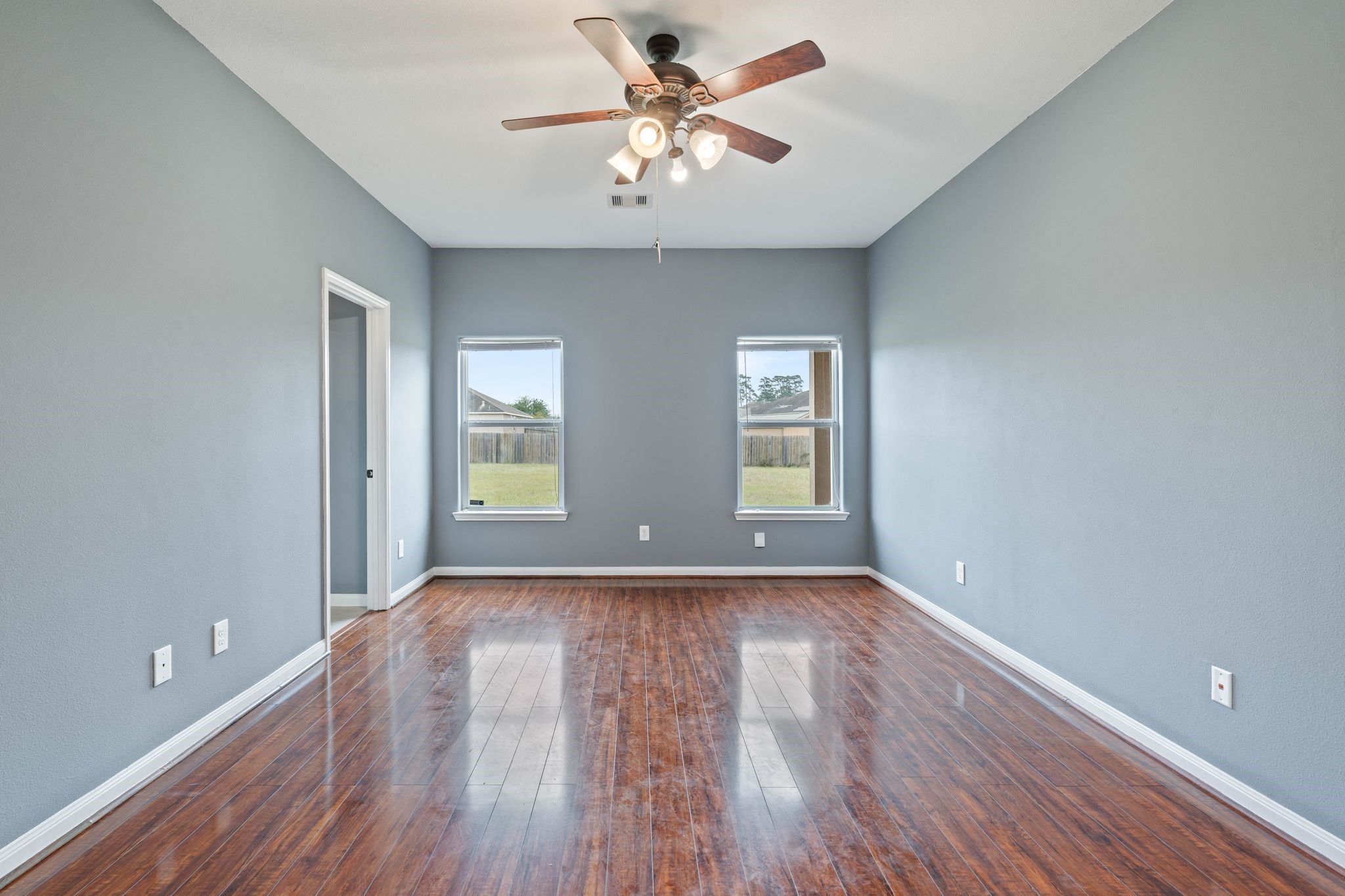18875 Maverick Ranch Road East Magnolia, TX 77355 - Photo 7 of 45 a view of an empty room with window and wooden floor
