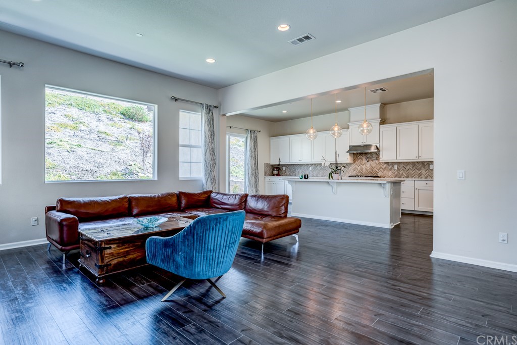 12370 Alamo Drive Rancho Cucamonga, CA 91739 - Photo 18 of 47 a living room with furniture and wooden floor