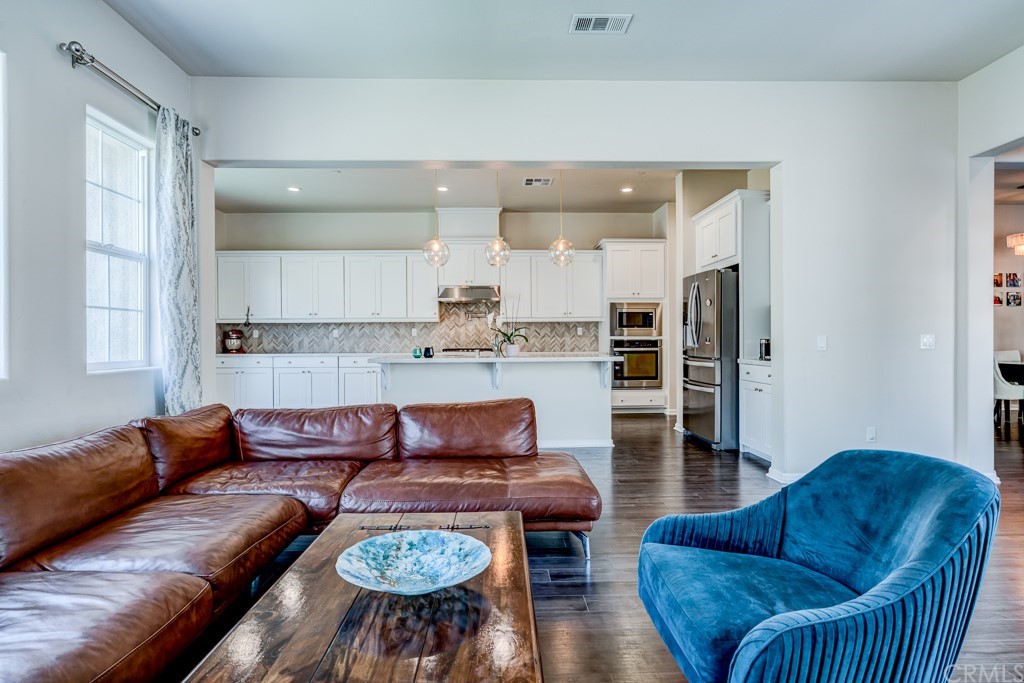 12370 Alamo Drive Rancho Cucamonga, CA 91739 - Photo 19 of 47 a living room with stainless steel appliances furniture and wooden floor