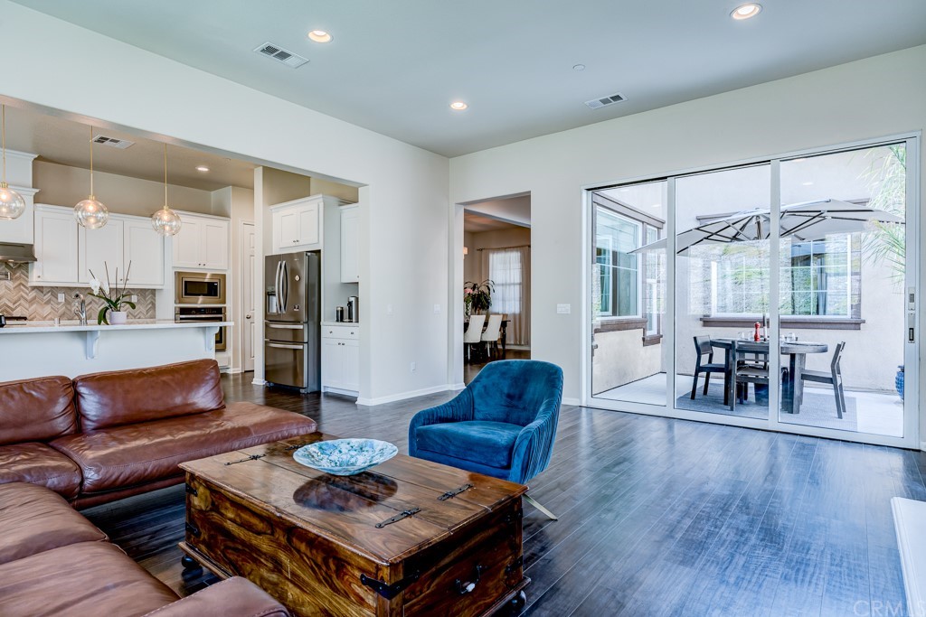 12370 Alamo Drive Rancho Cucamonga, CA 91739 - Photo 20 of 47 a living room with furniture and wooden floor