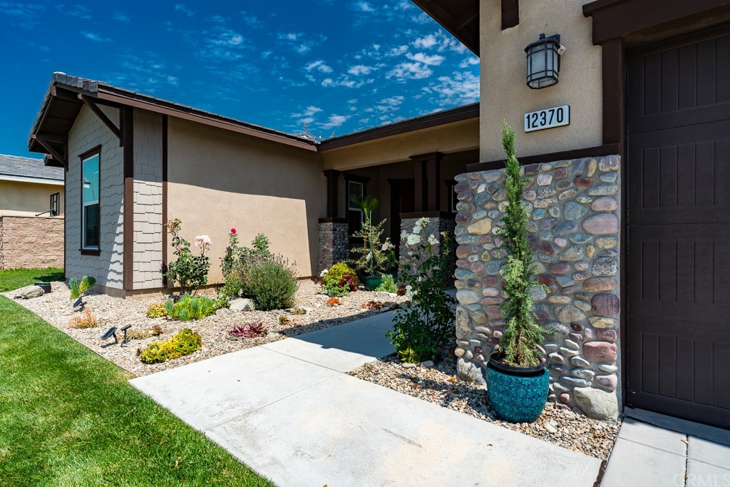 12370 Alamo Drive Rancho Cucamonga, CA 91739 - Photo 3 of 47 a view of a house with potted plants