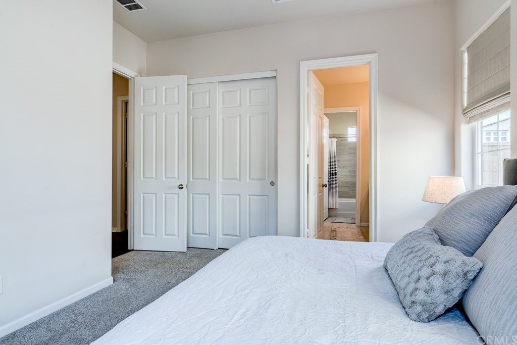 12370 Alamo Drive Rancho Cucamonga, CA 91739 - Photo 25 of 47 a bedroom with a bed and a couch