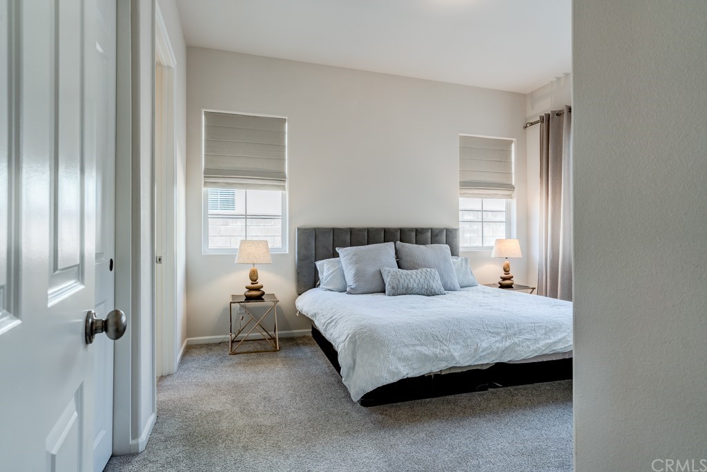 12370 Alamo Drive Rancho Cucamonga, CA 91739 - Photo 27 of 47 a bedroom with a bed and a window