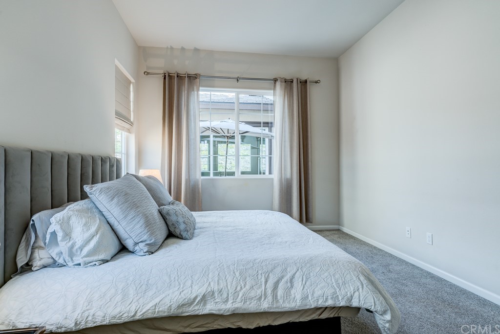 12370 Alamo Drive Rancho Cucamonga, CA 91739 - Photo 28 of 47 a bedroom with a bed and a window