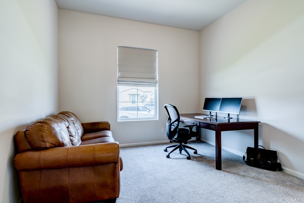 12370 Alamo Drive Rancho Cucamonga, CA 91739 - Photo 31 of 47 a livingroom with workspace and a couch