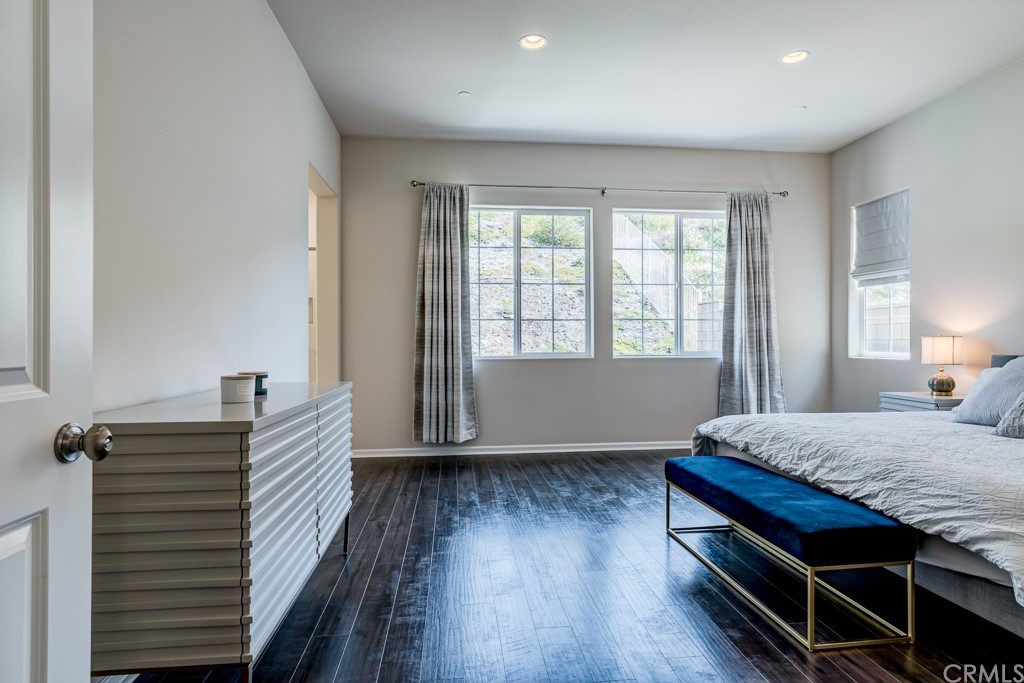 12370 Alamo Drive Rancho Cucamonga, CA 91739 - Photo 34 of 47 a bedroom with a bed and wooden floor