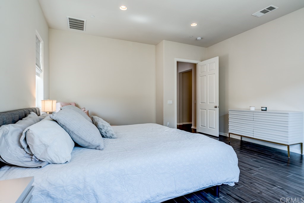 12370 Alamo Drive Rancho Cucamonga, CA 91739 - Photo 35 of 47 a bedroom with a bed and a window