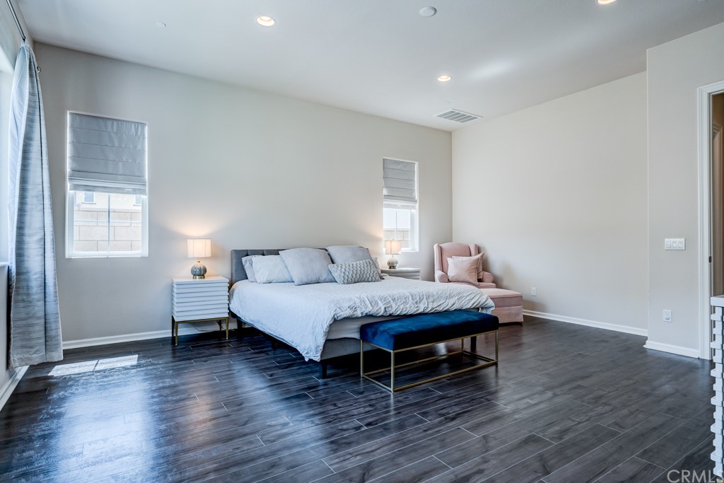 12370 Alamo Drive Rancho Cucamonga, CA 91739 - Photo 36 of 47 a living room with a bed furniture and a window