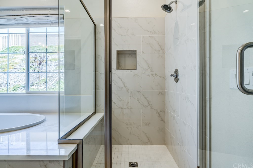 12370 Alamo Drive Rancho Cucamonga, CA 91739 - Photo 38 of 47 a bathroom with a shower and a sink