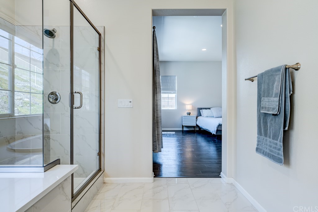 12370 Alamo Drive Rancho Cucamonga, CA 91739 - Photo 39 of 47 a bathroom with a shower and a toilet