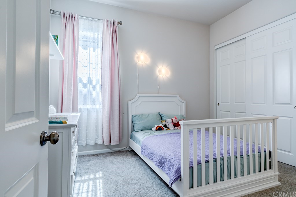 12370 Alamo Drive Rancho Cucamonga, CA 91739 - Photo 42 of 47 a bedroom with a bed and a window