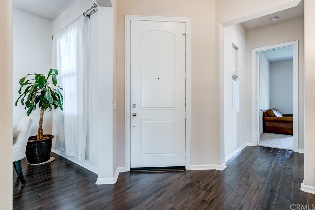 12370 Alamo Drive Rancho Cucamonga, CA 91739 - Photo 7 of 47 a view of a hallway with wooden floor and closet
