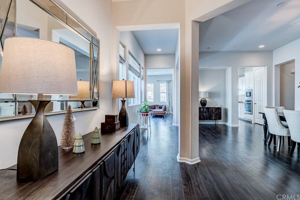12370 Alamo Drive Rancho Cucamonga, CA 91739 - Photo 8 of 47 a hallway with dining table and chairs