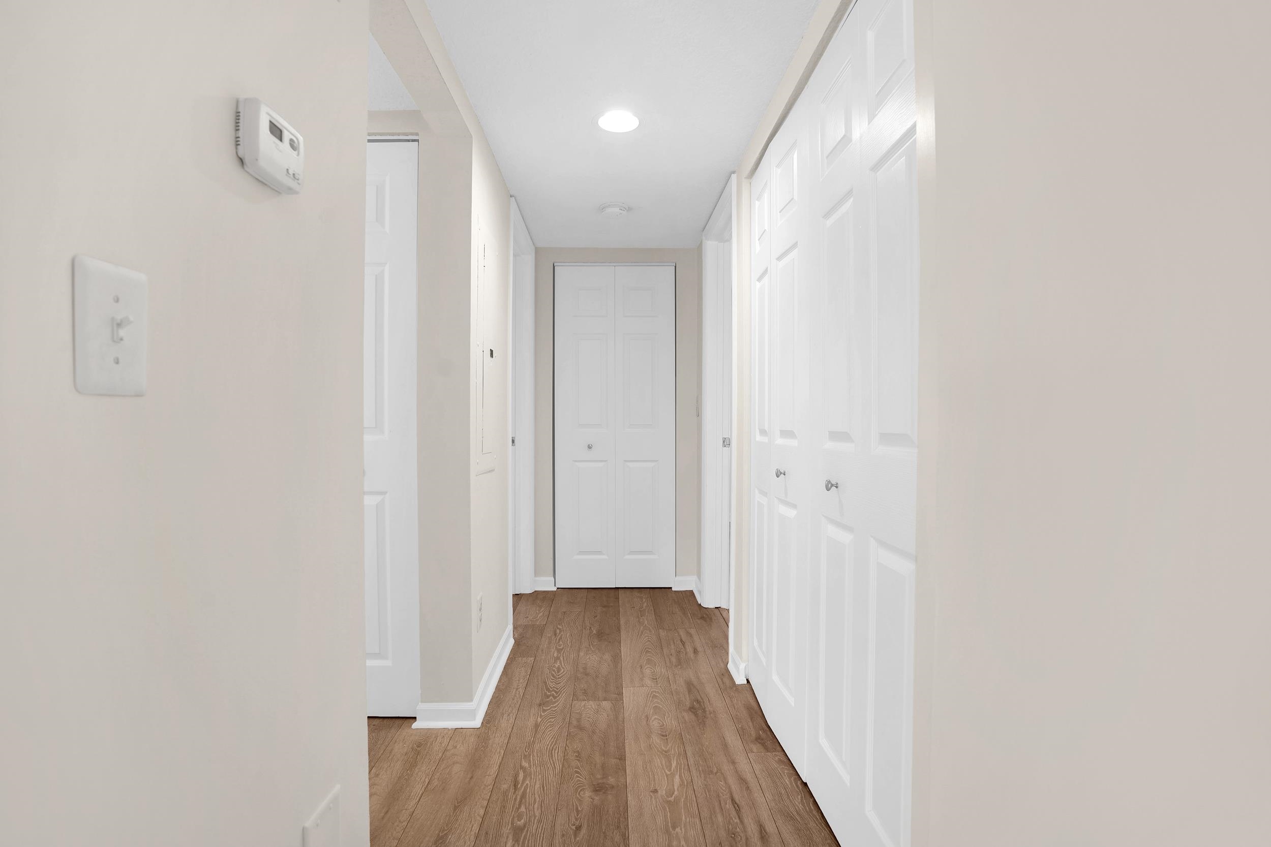 204 16th Street, Unit G St. Augustine Beach, FL 32080 - Photo 20 of 31 a view of a hallway with wooden floor
