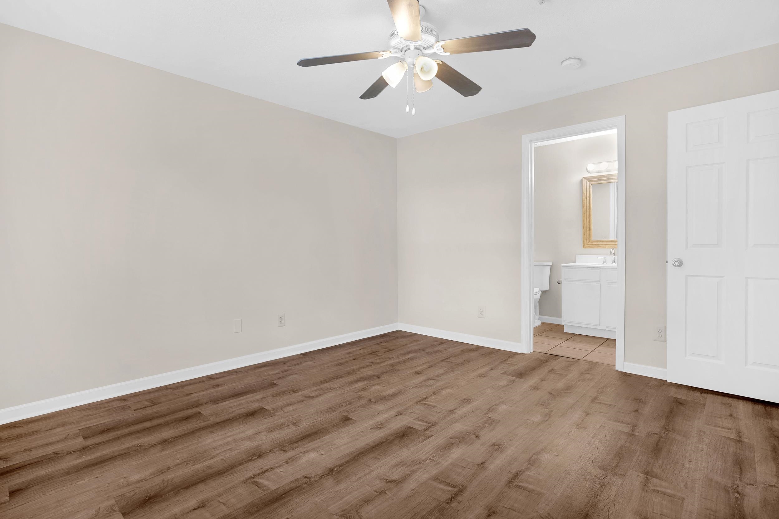 204 16th Street, Unit G St. Augustine Beach, FL 32080 - Photo 25 of 31 wooden floor in an empty room