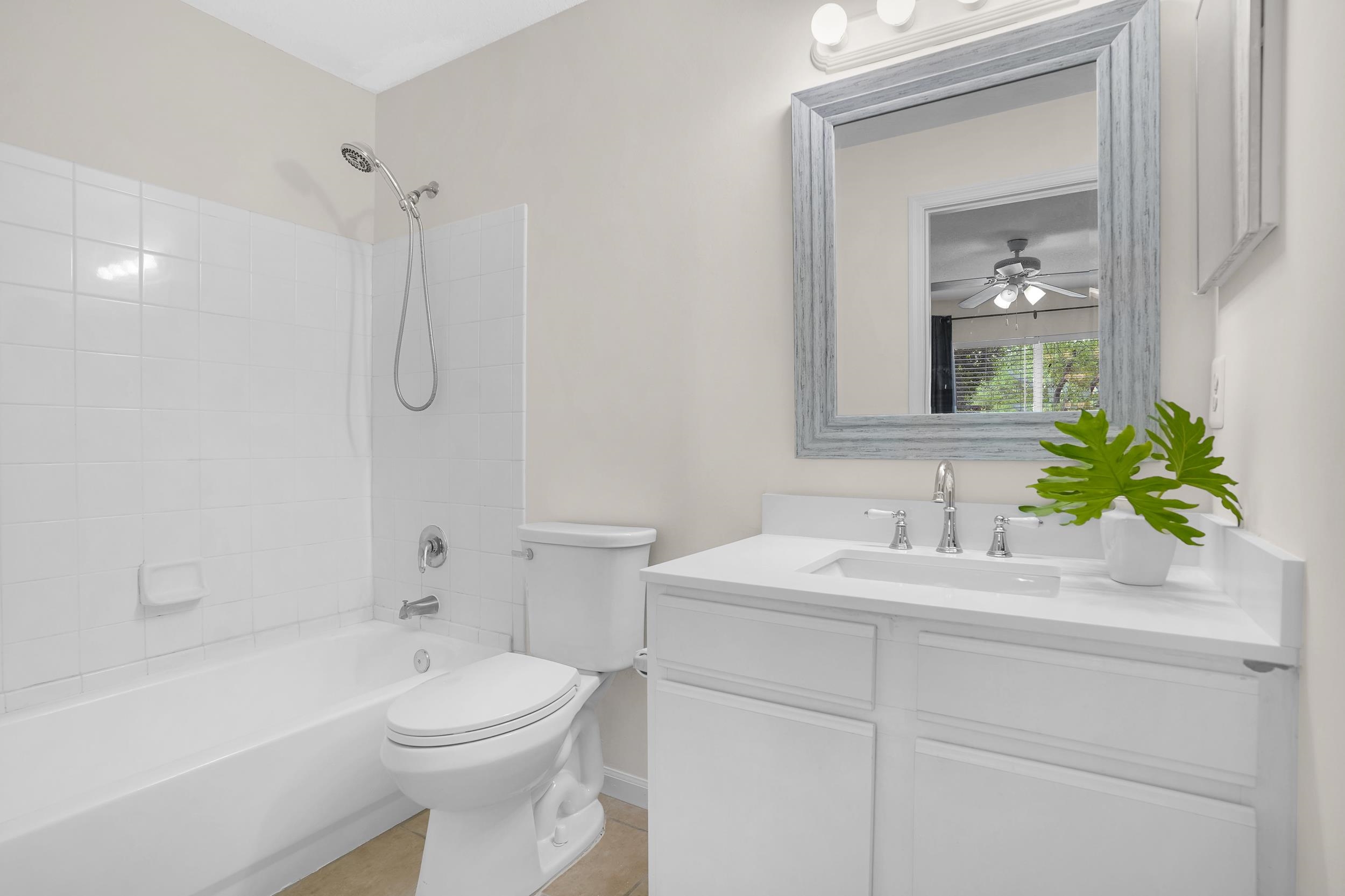 204 16th Street, Unit G St. Augustine Beach, FL 32080 - Photo 26 of 31 a bathroom with a sink a toilet and shower