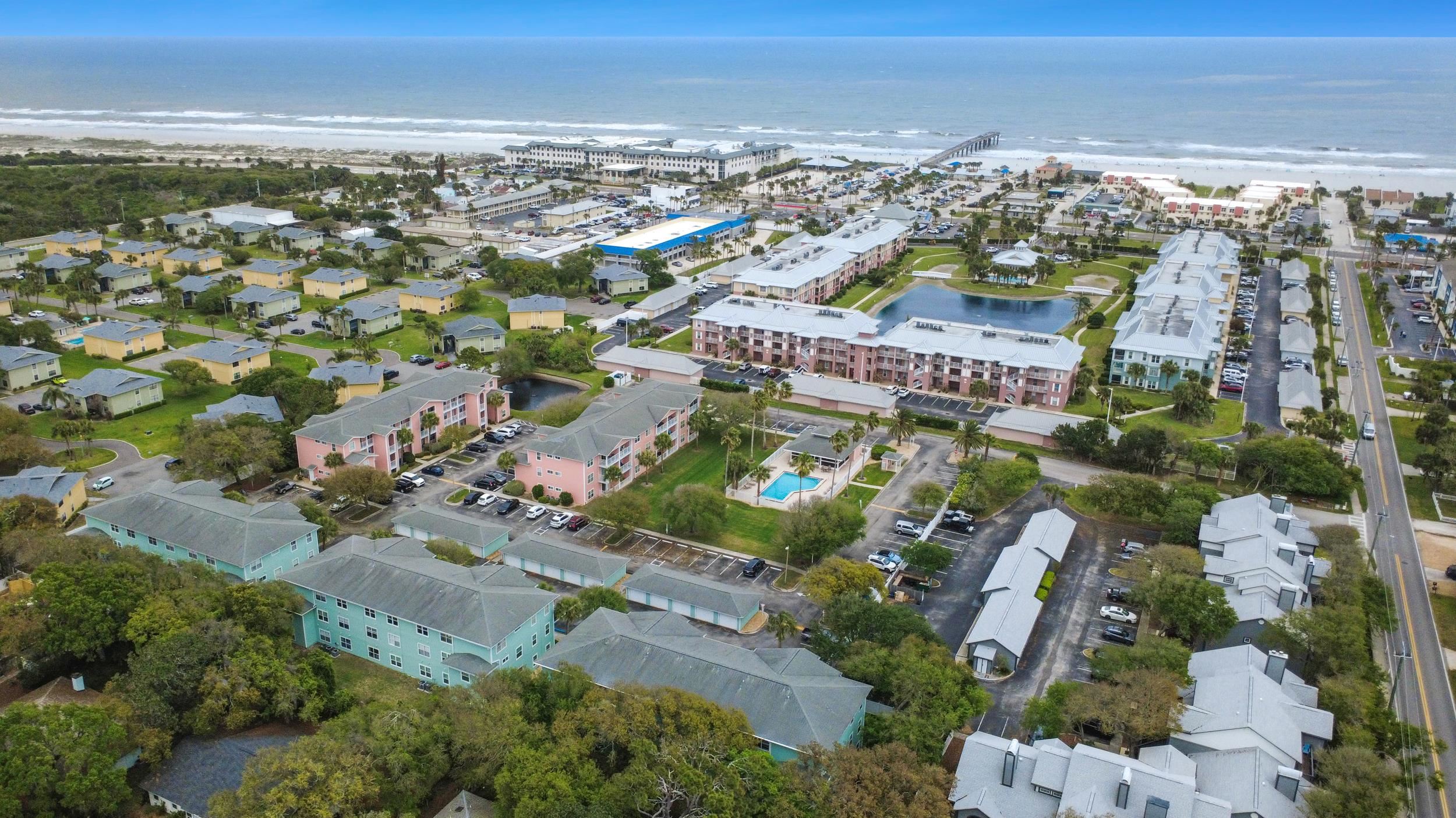 204 16th Street, Unit G St. Augustine Beach, FL 32080 - Photo 30 of 31 an aerial view of residential building and ocean