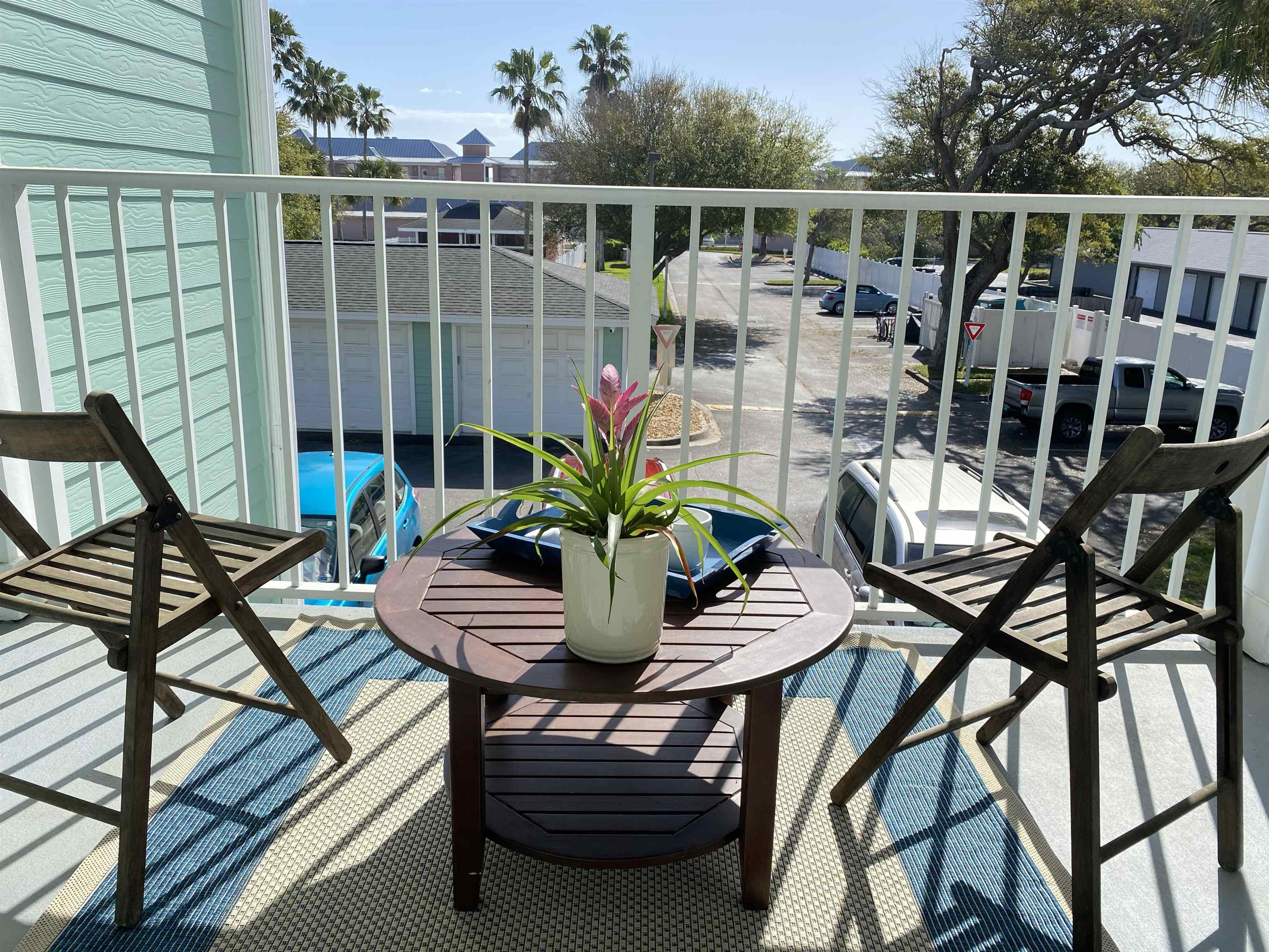 204 16th Street, Unit G St. Augustine Beach, FL 32080 - Photo 7 of 31 a view of a chairs and table in patio