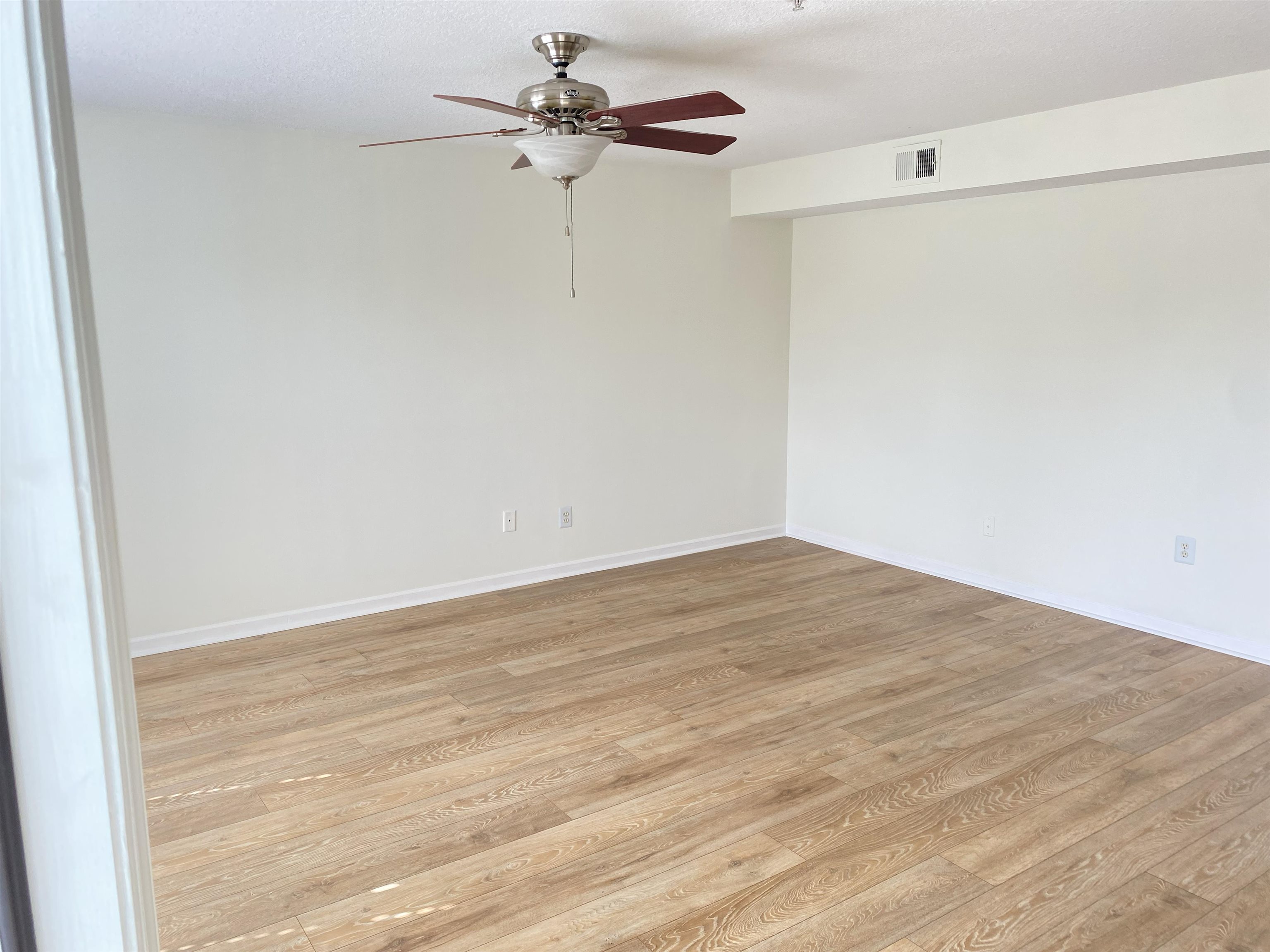 204 16th Street, Unit G St. Augustine Beach, FL 32080 - Photo 10 of 31 a view of empty room with wooden floor