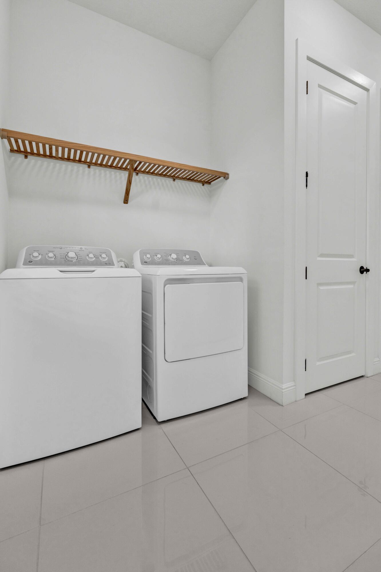 5501 Santa Rosa Lane Westlake, FL 33470 - Photo 23 of 31 a utility room with dryer and washer