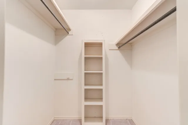 a view of an empty walk in closet